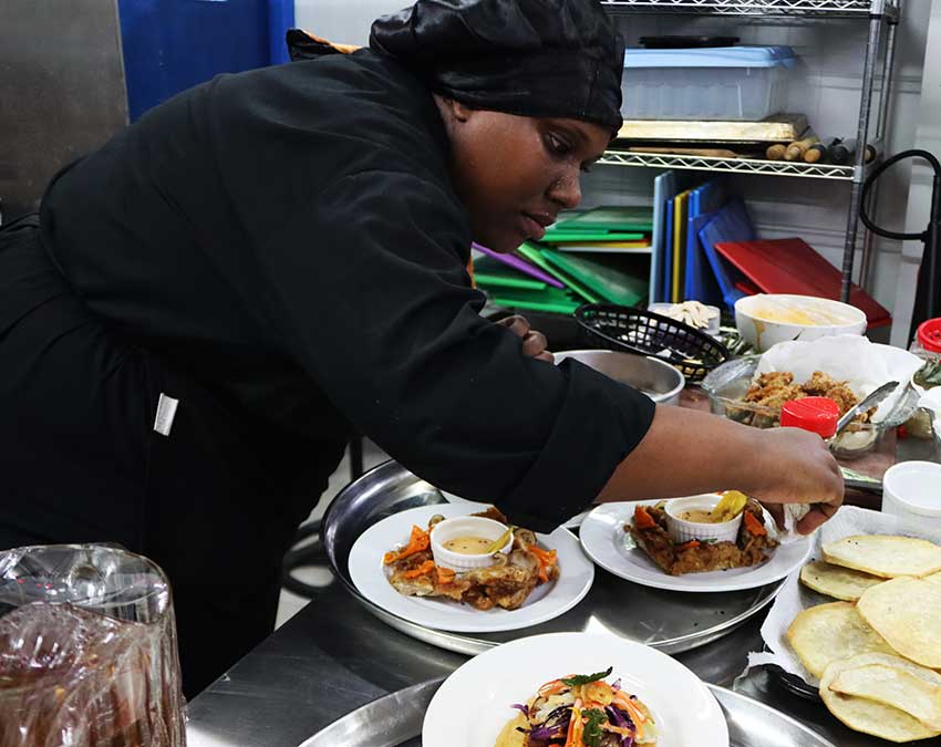 A chef carefully arranges her delicious Taiwanese dishes ahead of the competition.