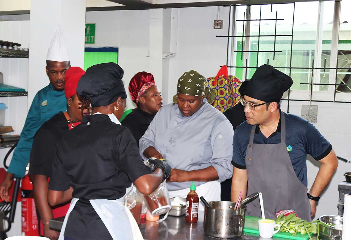 Chefs at NSDC’s Bisee centre preparing Taiwanese dishes for the competition. At far left is one of the competition’s judges. 