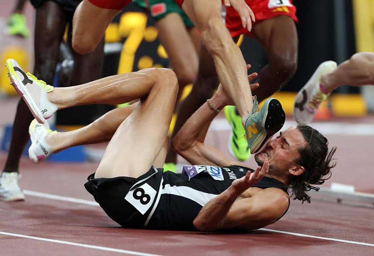 TOKYO, JAPAN ‑ SEPTEMBER 13: Geordie Beamish of Team New Zealand avoids the foot of Jean‑Simon Desgagnes of Team Canada as he falls to the ground during the the Men's 3000 Metres Steeplechase Heats on day one of the World Athletics Championships Tokyo 2025 at National Stadium on September 13, 2025 in Tokyo, Japan. [Photo by Emilee Chinn]