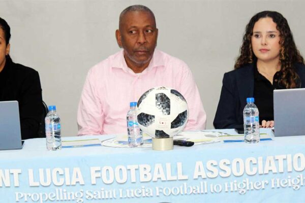 Cooper (centre) flanked by CONCACAF’s Lopez (right) and Felix-Toussaint (left).