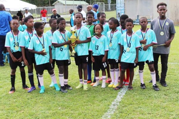Mabouya Valley display its Under-10 Championship trophy