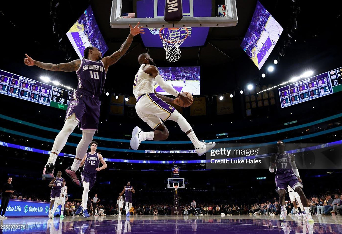 DECEMBER 28: Lebron James #23 of the Los Angeles Lakers dunks the ball against Demar Derozan #10 of the Sacramento Kings during the second quarter at Crypto.com Arena on December 28, 2025 in Los Angeles, California. NOTE TO USER: User expressly acknowledges and agrees that, by downloading and or using this photograph, user is consenting to the terms and conditions of the Getty Images License Agreement. (Photo by Luke Hales/Getty Images)