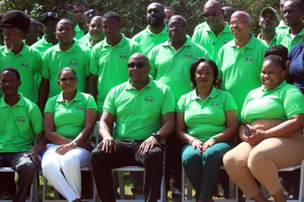 Minister Shawn Edward (center) with ministry officials and drivers at Saturday’s drivers retreat.