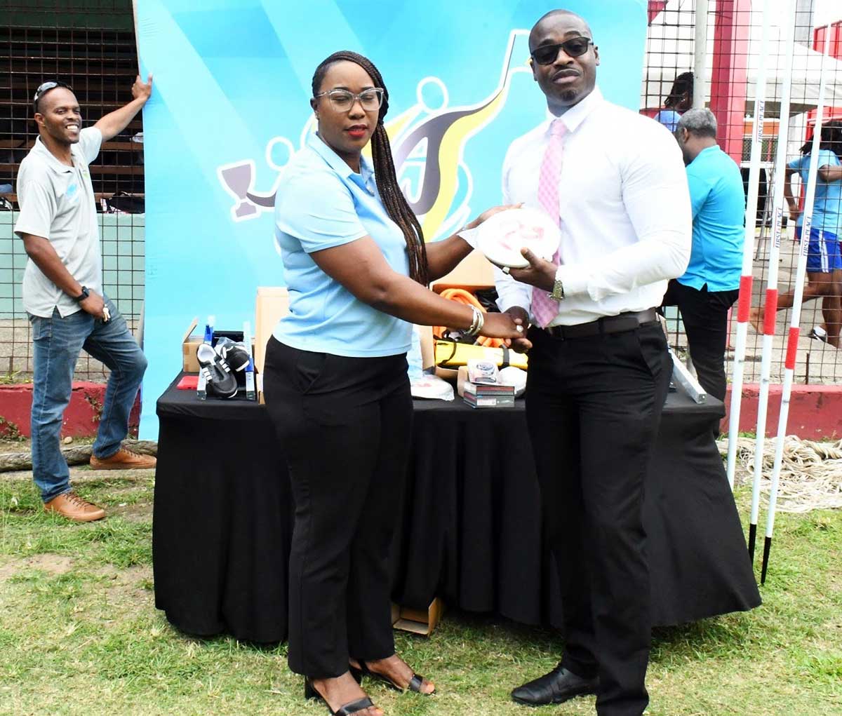 Sports Minister Casimir presents sporting equipment to SLAA officials [Photo credit: MYDS]
