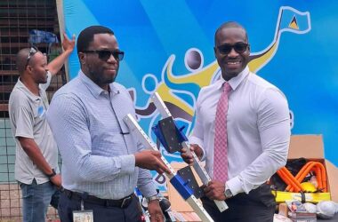 Sports Minister Casimir presents sporting equipment to SLAA officials [Photo credit: MYDS]