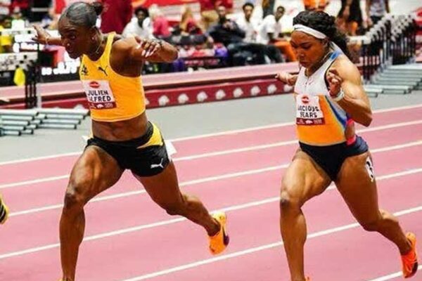 Julien Alfred, left, edges Jacious Spears to win the women’s 60 metres at the Tyson Invitational in Arkansas, USA on Friday [Photo credit: CMC]