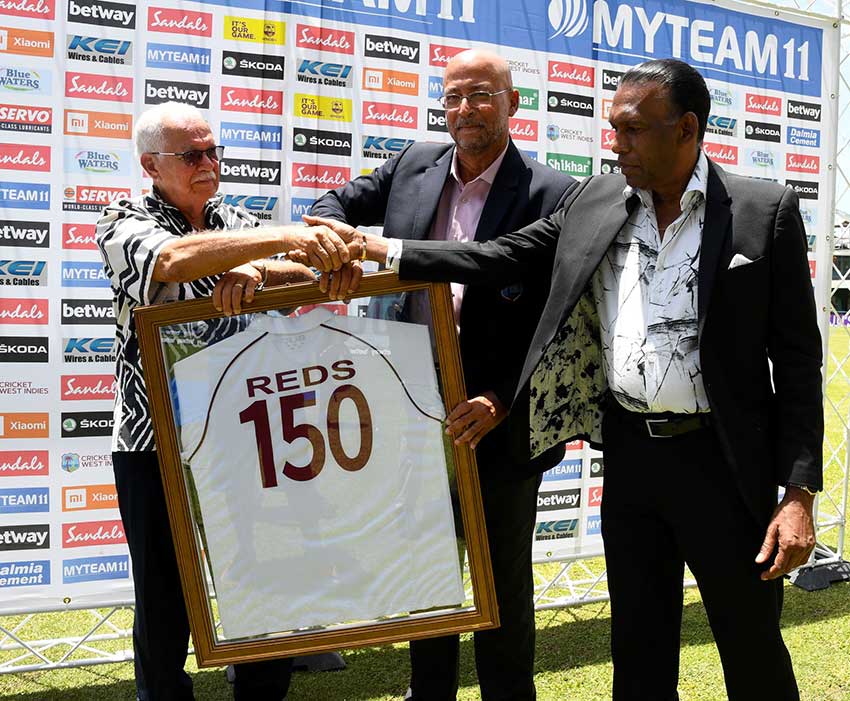 Joseph “Reds” Perreira, left, showcases his award with Ricky Skerritt, President of Cricket West Indies, and Billy Heaven, right, President of the Jamaica Cricket Association on Sunday. (Photo via T&T Guardian)