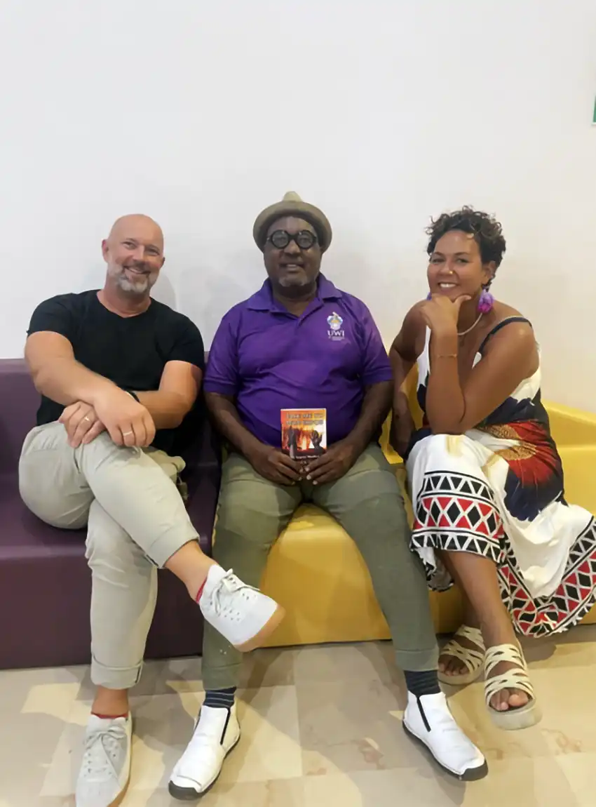 Dr Travis Weekes (centre) with David Erbel and Syringa Jean Baptiste (Photo via Olivianna Weekes)