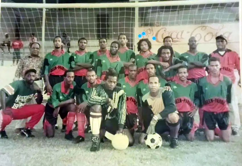 Green Parrot VSADC Champion Team with sponsor Edward “Chef Harry” Joseph and formidable legendary coach Vasso both standing in back row at far end, with Stephen “Coolie” Darling standing in back row forth from right.