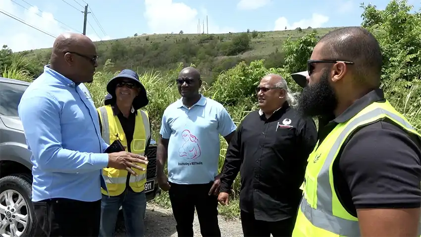 Infrastructure Minister Edward (Left) in discussion with VF North Parliamentarian Moses “Musa” Jn Baptiste and officials of Nationwide Construction Limited.