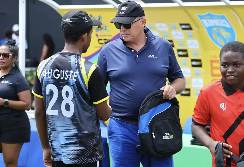 CPL's CEO, Pete Russell, hands out CPL Schoolyard book bags in Saint Lucia. [Photo credit : CPL]