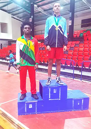 Saint Lucia’s Daniel Martin (right) captured gold alongside Guyana’s Oasis Prince on the medal podium [Photo credit : Kaiteur Sports] 