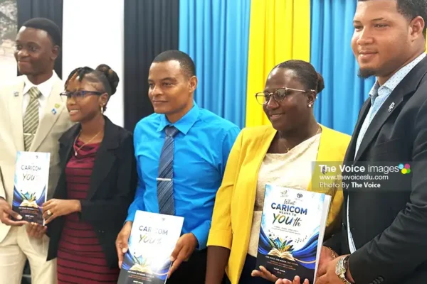 Left to right: Deputy CARICOM Youth Ambassadors for Saint Lucia Naeem Philbert and Davianne Alexander, Deputy Permanent Secretary in the Ministry of Youth Development and Sports Mr. Rohan Lubon, CARICOM Youth Ambassadors for Saint Lucia Shelly Desir and Alens Plante [Photo credit: The VOICE]