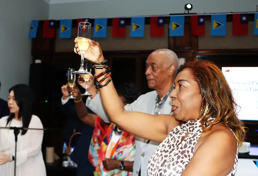 H.E. Felix Finisterre, Acting Governor-General of Saint Lucia, and Hon. Alvina Reynolds, President of the Senate, join attendees in toasting to Taiwan’s 115th National Day Anniversary. (Photo credit: TTM)