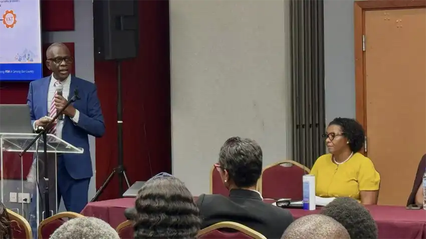 PM Philip J Pierre addresses attendees at businees forum [Photo credit: OPM]
